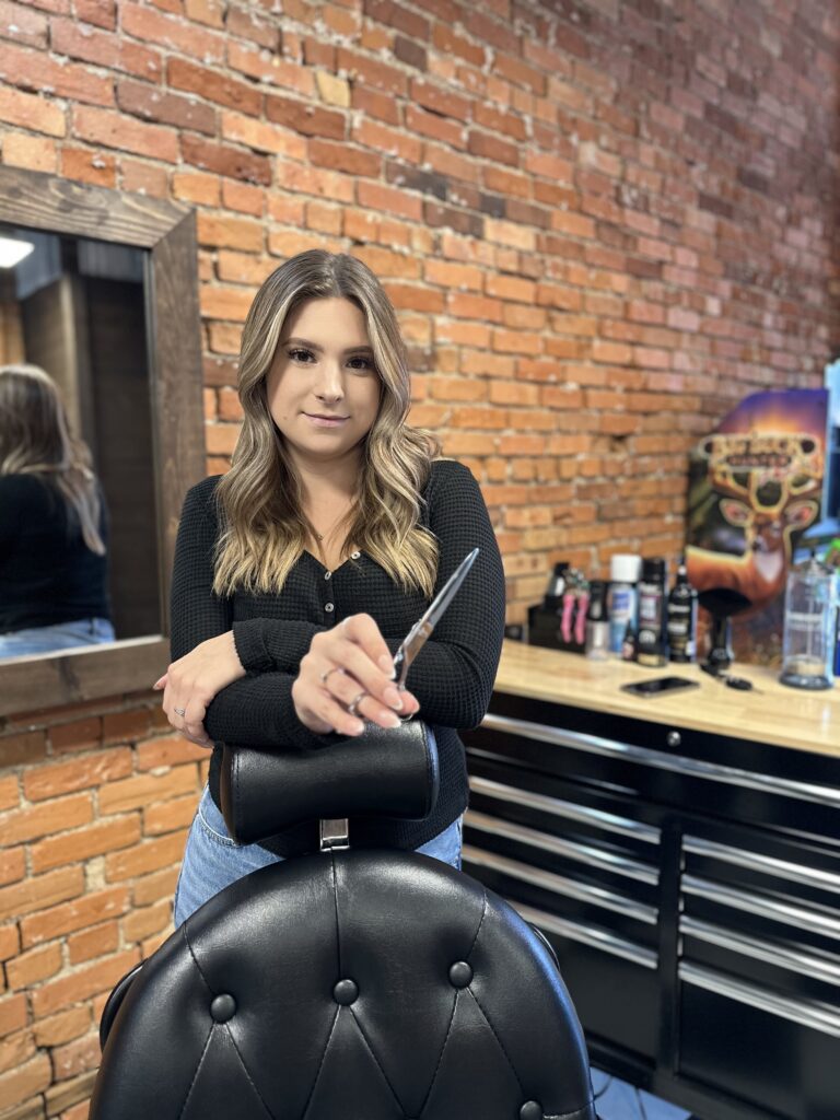 Taylor, a barber at The Faithful Barber & Co barbershop. Barber in Aylmer Ontario.