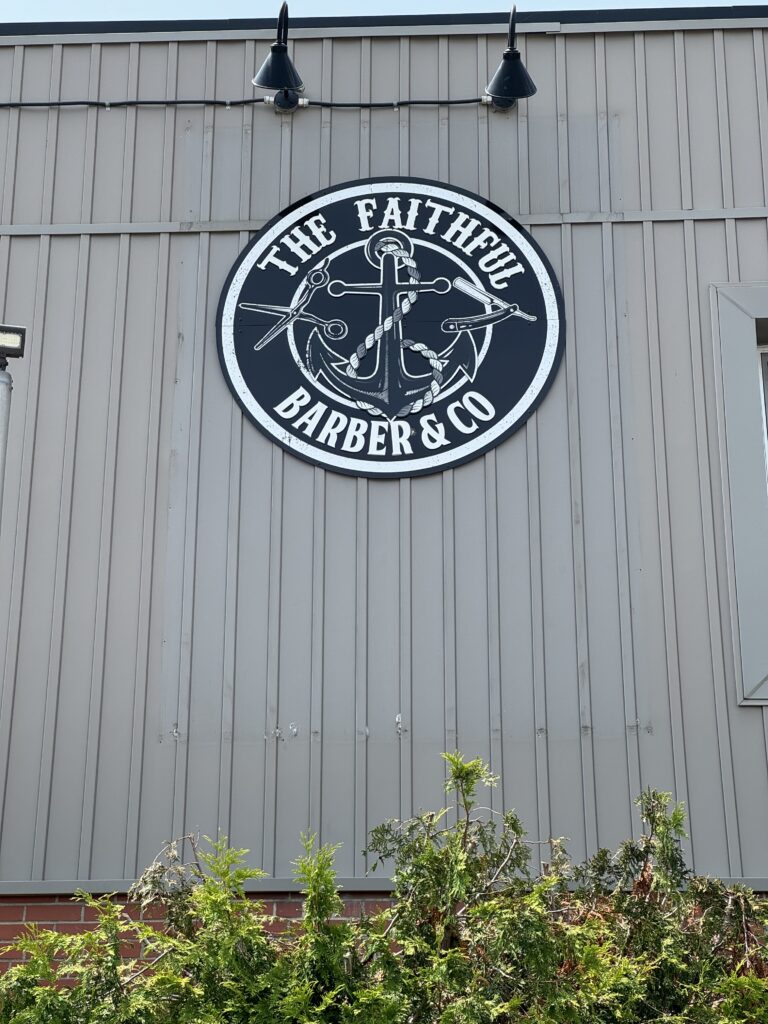 The Faithful Barber & Co barbershop owner with his dog. Barber in Aylmer Ontario.