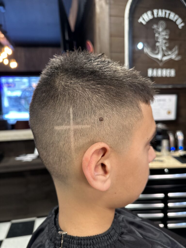 Boys fade with design performed at The Faithful Barber & Co barbershop. Barber in Aylmer Ontario.